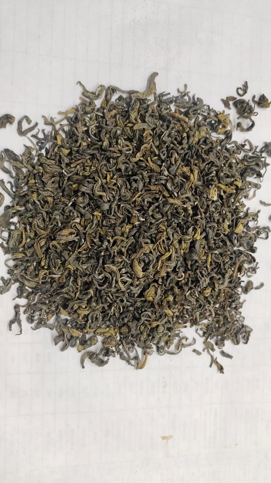 Premium Assam green tea — fine whole leaf